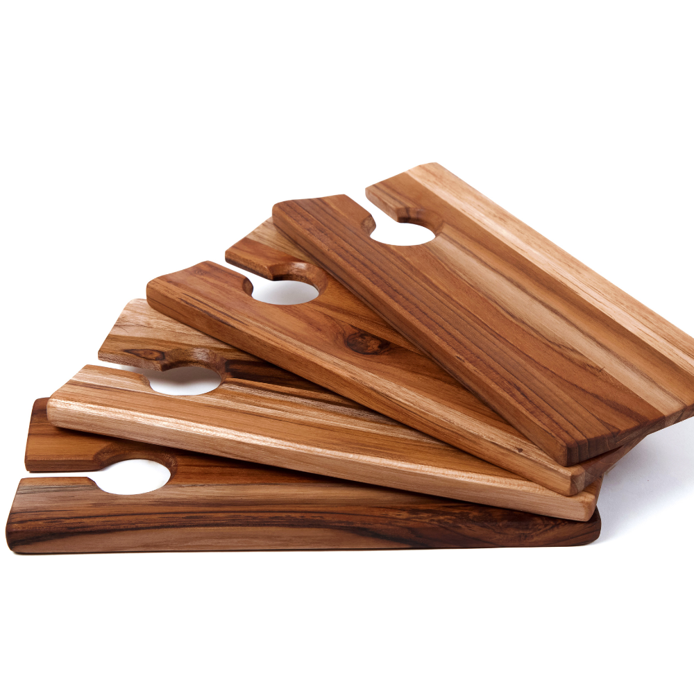 Set of four rectangular teakwood wine and canape catering plates with glass holder slots and natural wood grain.