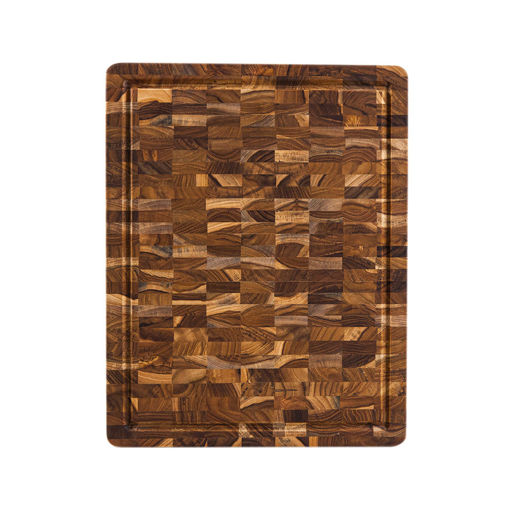 Rectangular Teakhaus end grain cutting board with a juice groove and distinctive checkerboard wood pattern.