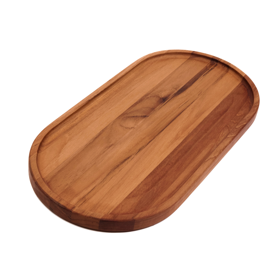 Large edge grain teakwood oval serving tray with a narrow rim on a white background.