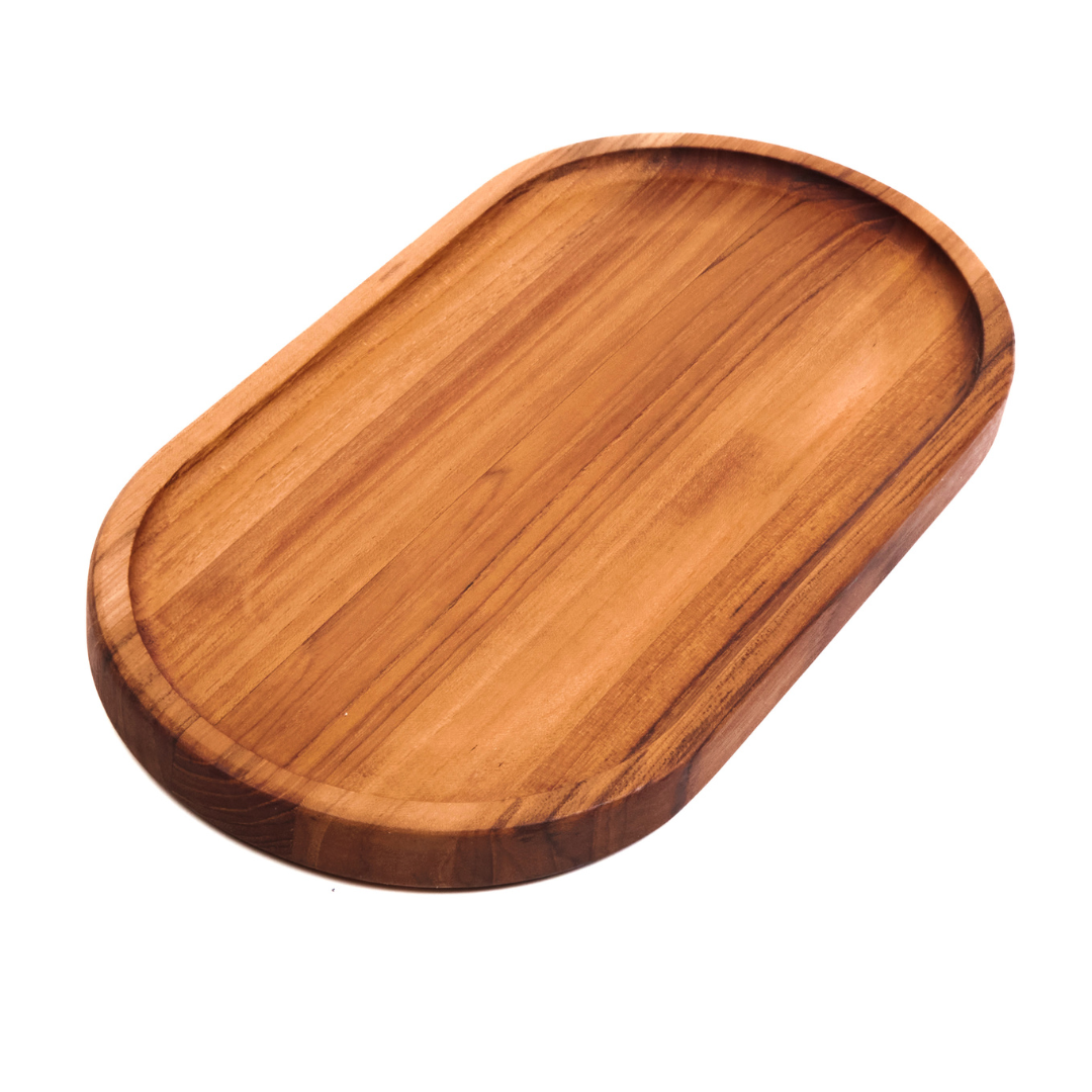 Small edge grain teakwood oval serving tray featuring a narrow raised rim on a white background.