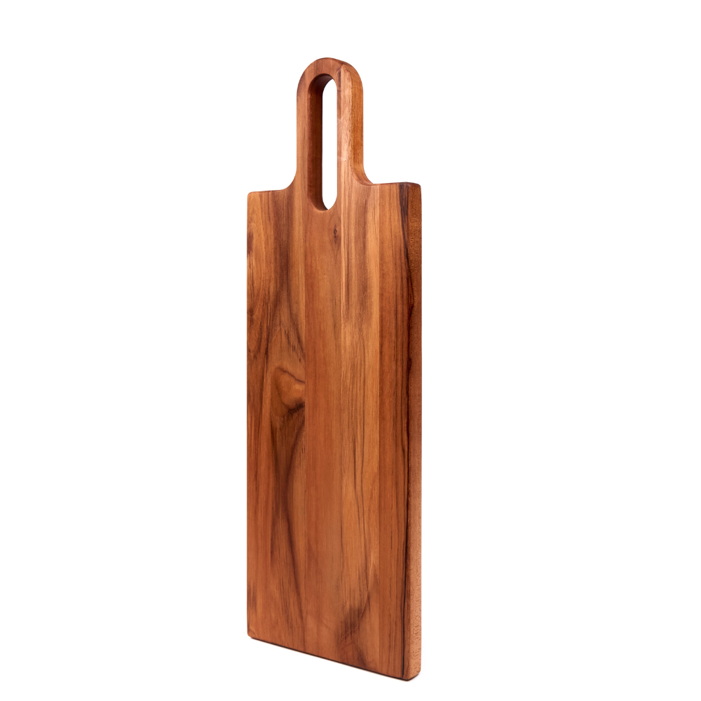 Long teakwood serving board with a cutout handle and natural wood grain patterns on a white background.