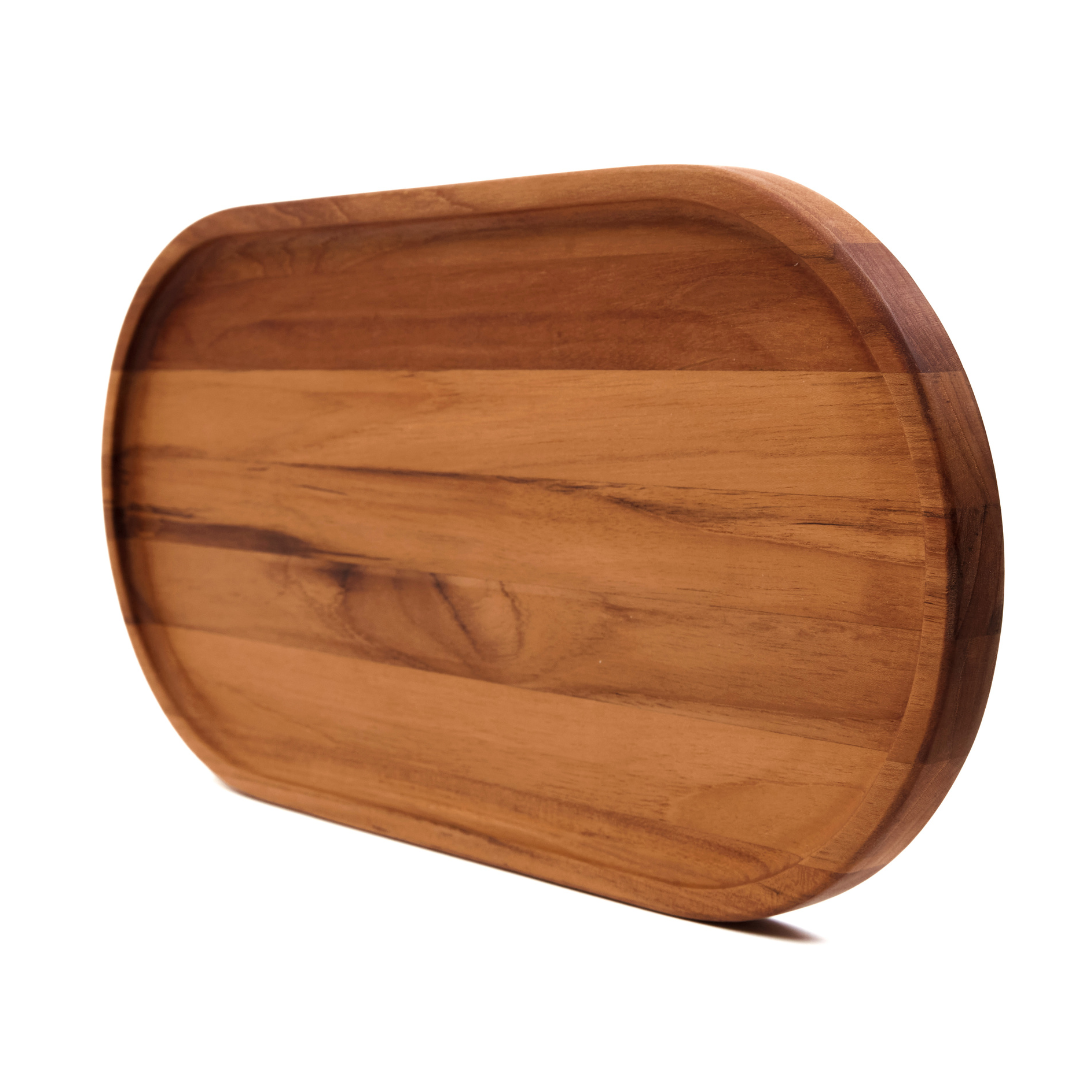 Large oval teakwood serving tray with a narrow rim and natural edge grain on a white background.
