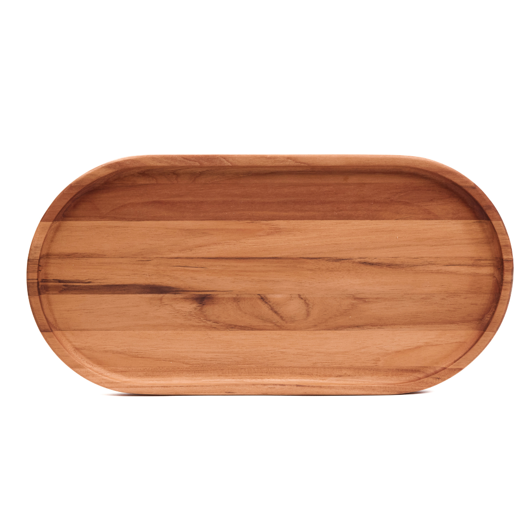 Large edge grain teakwood oval serving tray with a narrow rim on a white background.