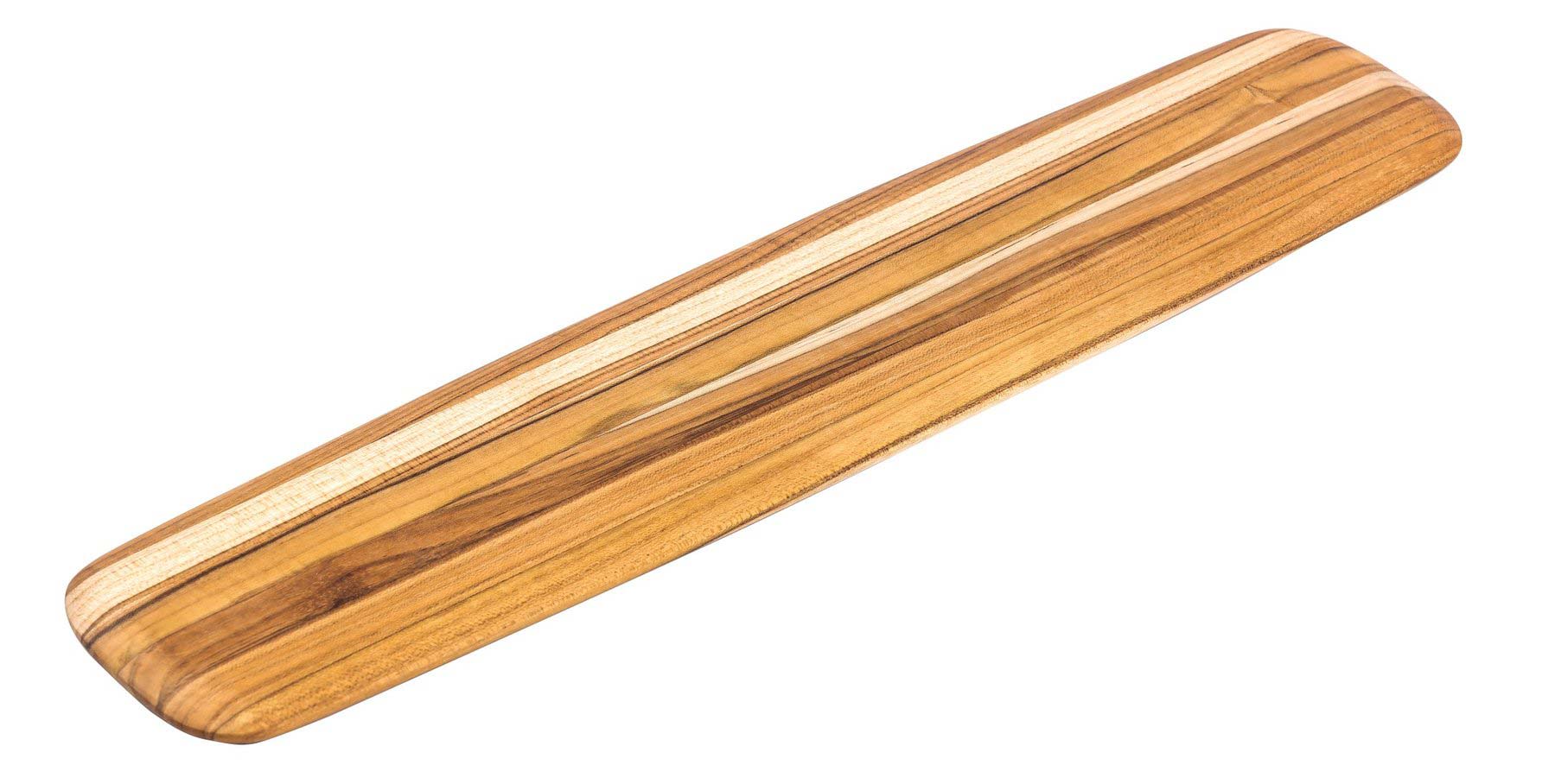 Long teakwood serving board with rounded edges and natural wood grain for charcuterie and appetizers.