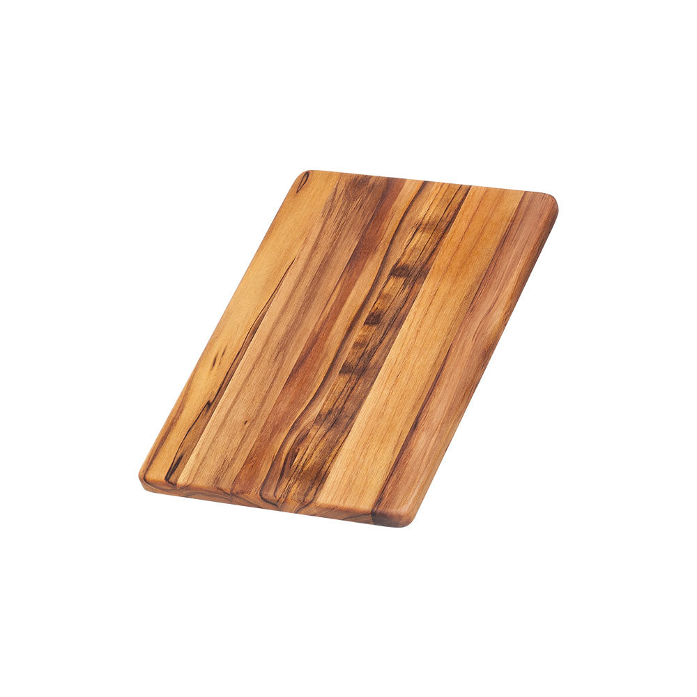 Rectangular edge grain teakwood cutting board with a natural finish and warm brown wood grain.