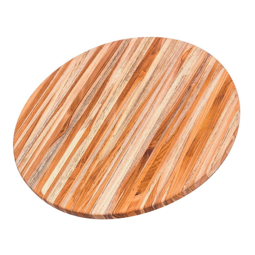 Large round teakwood cutting board with natural edge grain patterns, perfect for food prep and serving.